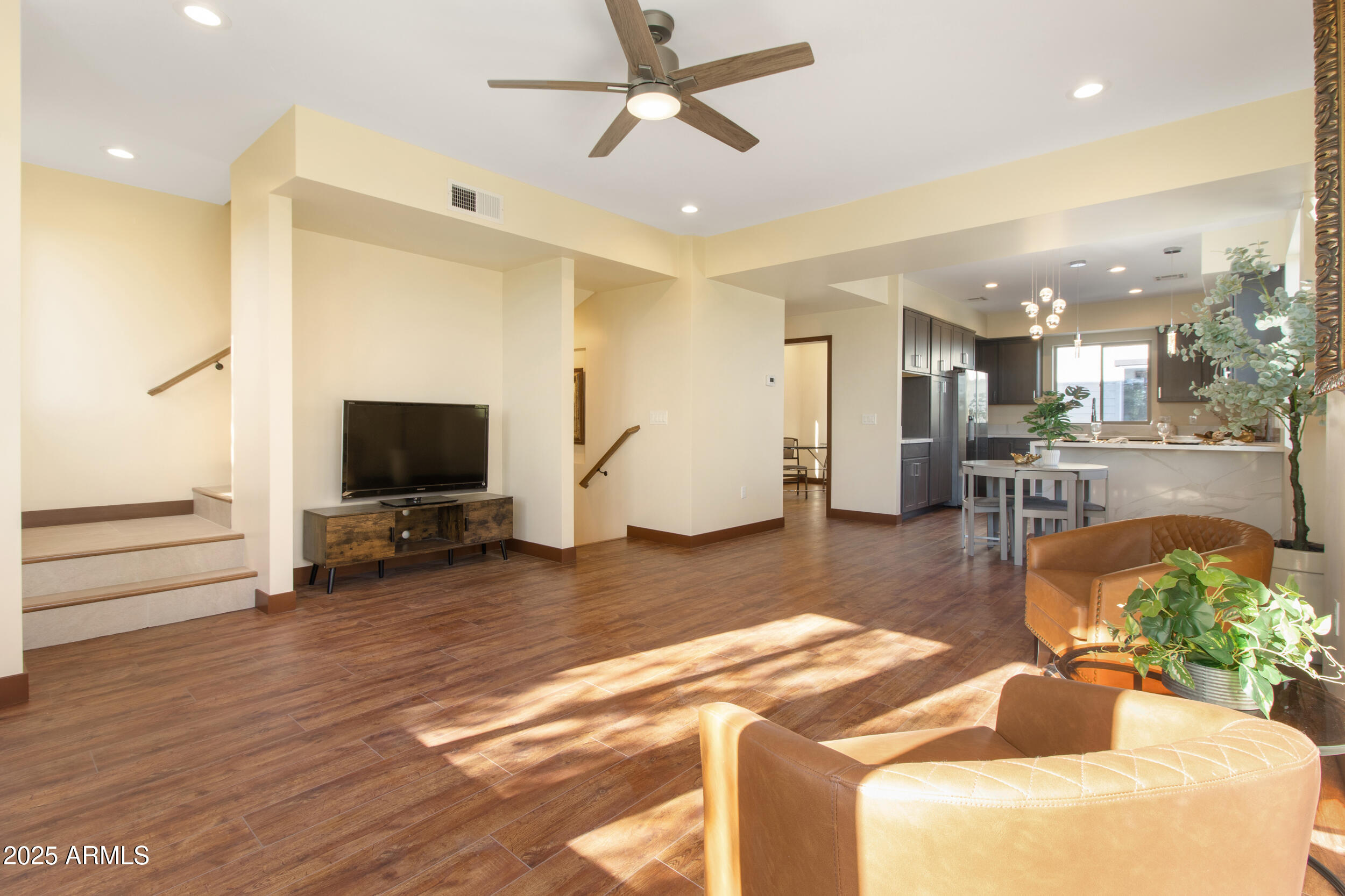 2014 West Lawrence Road Phoenix, AZ 85015 - Photo 10 of 24 a living room with furniture and a flat screen tv