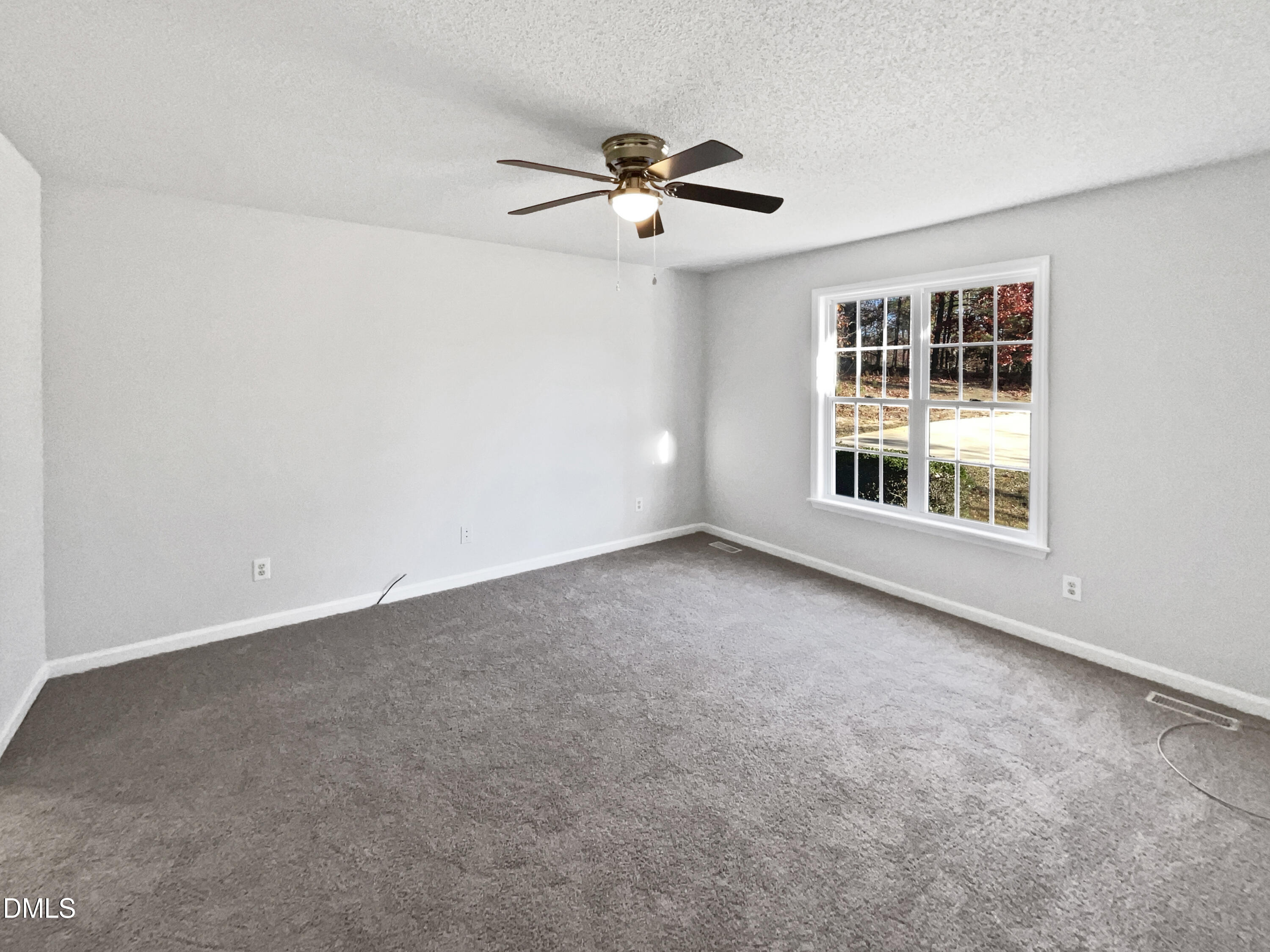 9025 Ferrell Road Zebulon, NC 27597 - Photo 11 of 19 a view of an empty room with a window