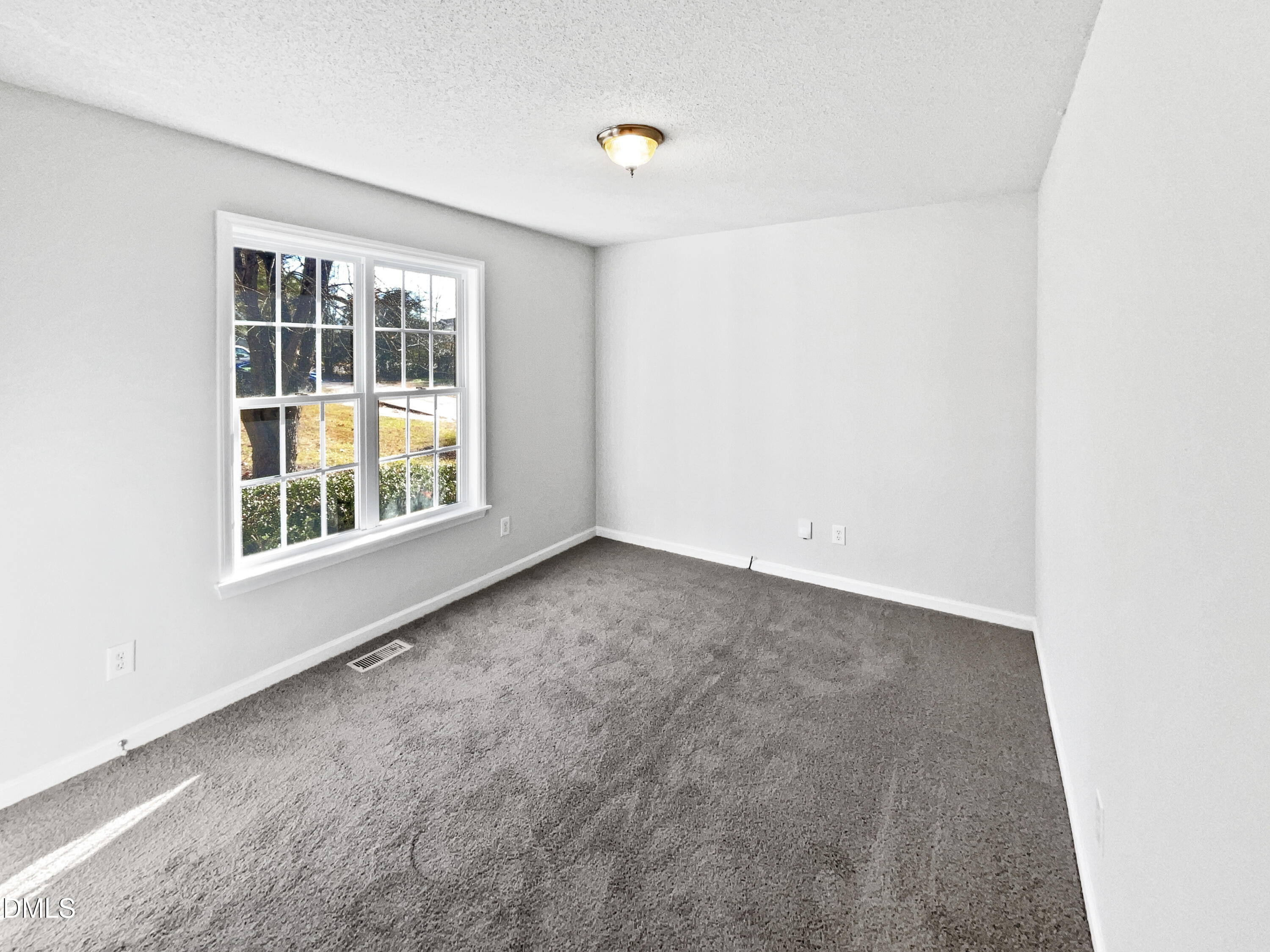 9025 Ferrell Road Zebulon, NC 27597 - Photo 12 of 19 a view of an empty room with a window