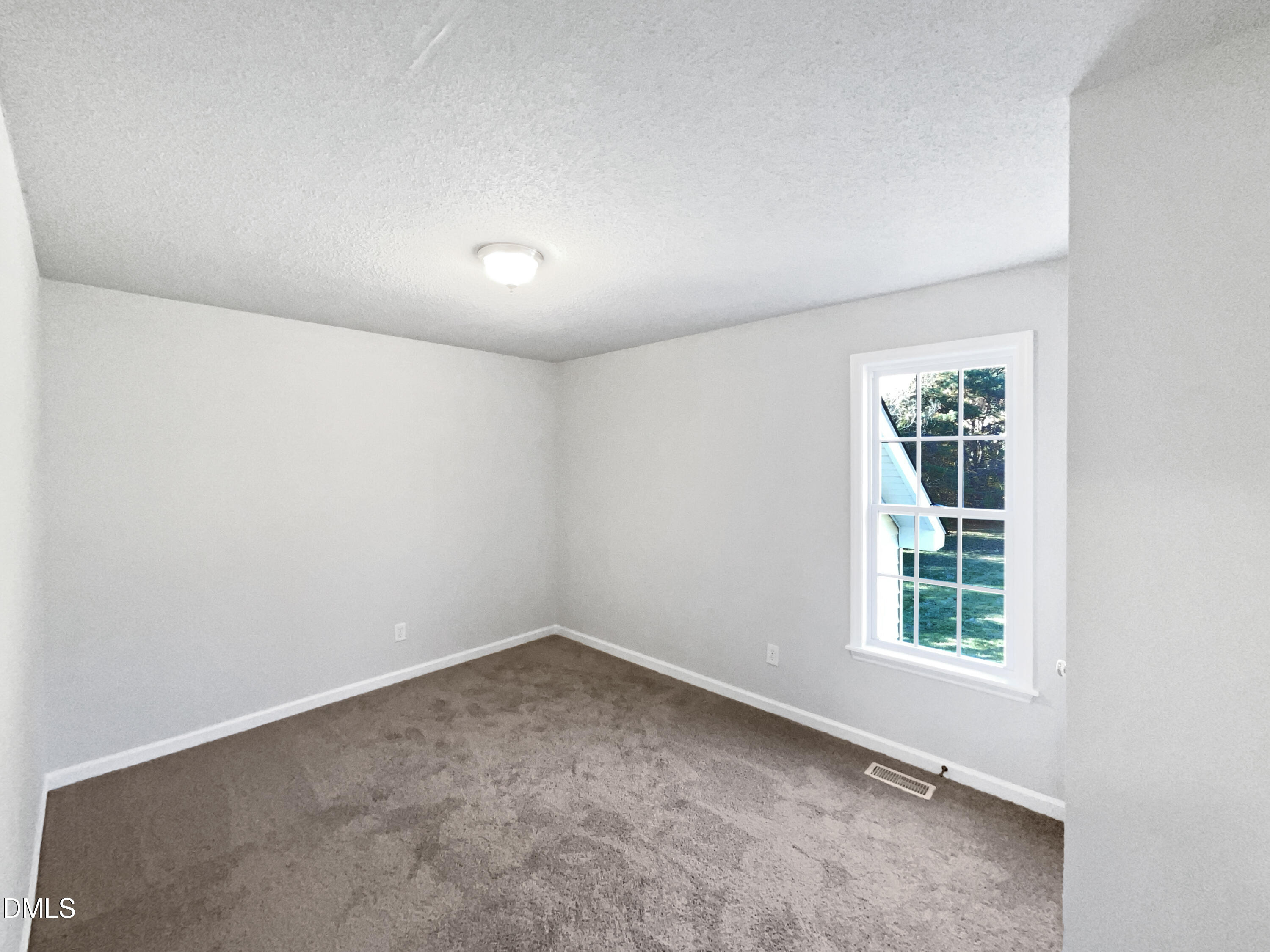 9025 Ferrell Road Zebulon, NC 27597 - Photo 13 of 19 an empty room with a window