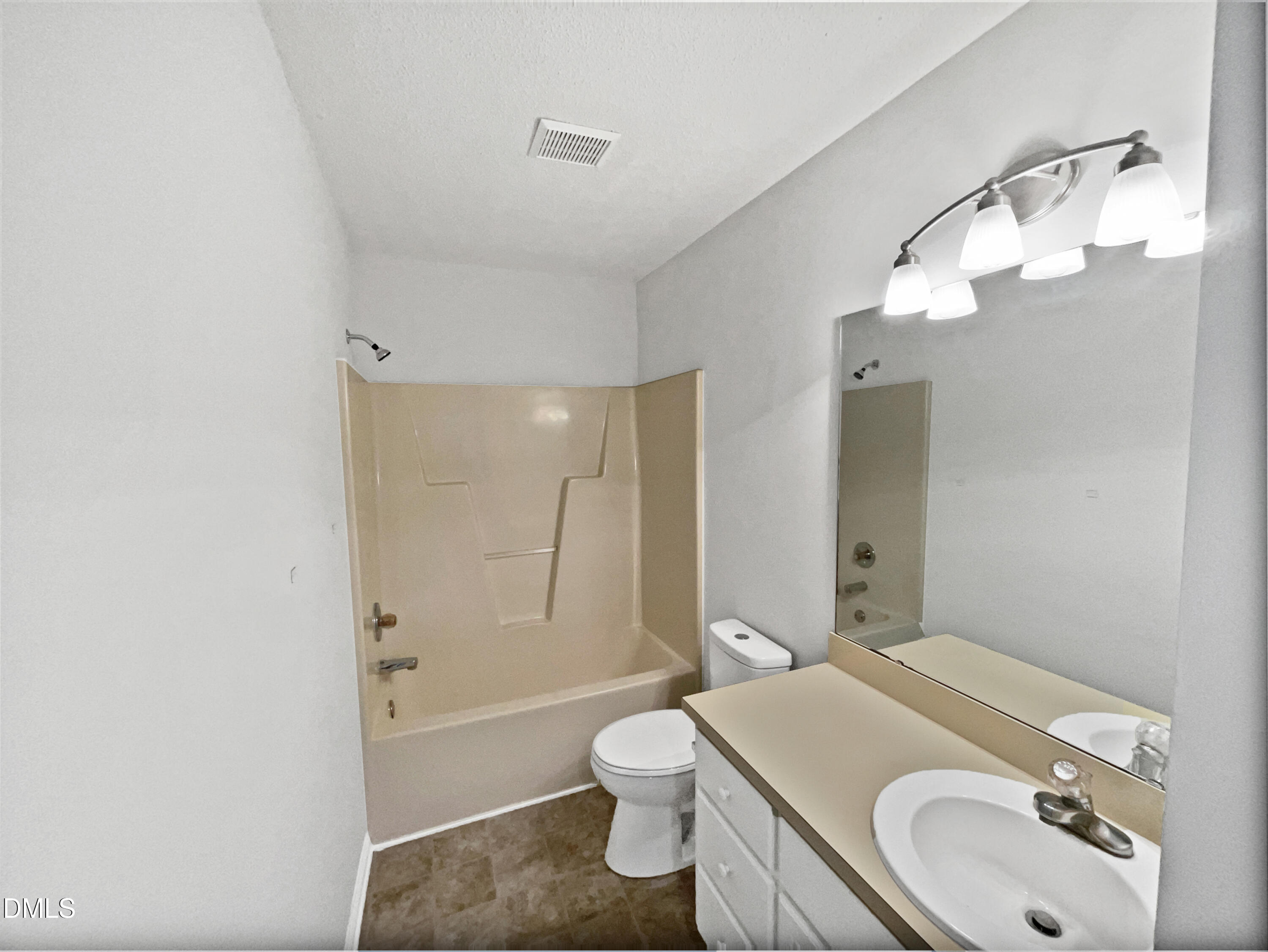 9025 Ferrell Road Zebulon, NC 27597 - Photo 16 of 19 a bathroom with a granite countertop sink toilet and shower
