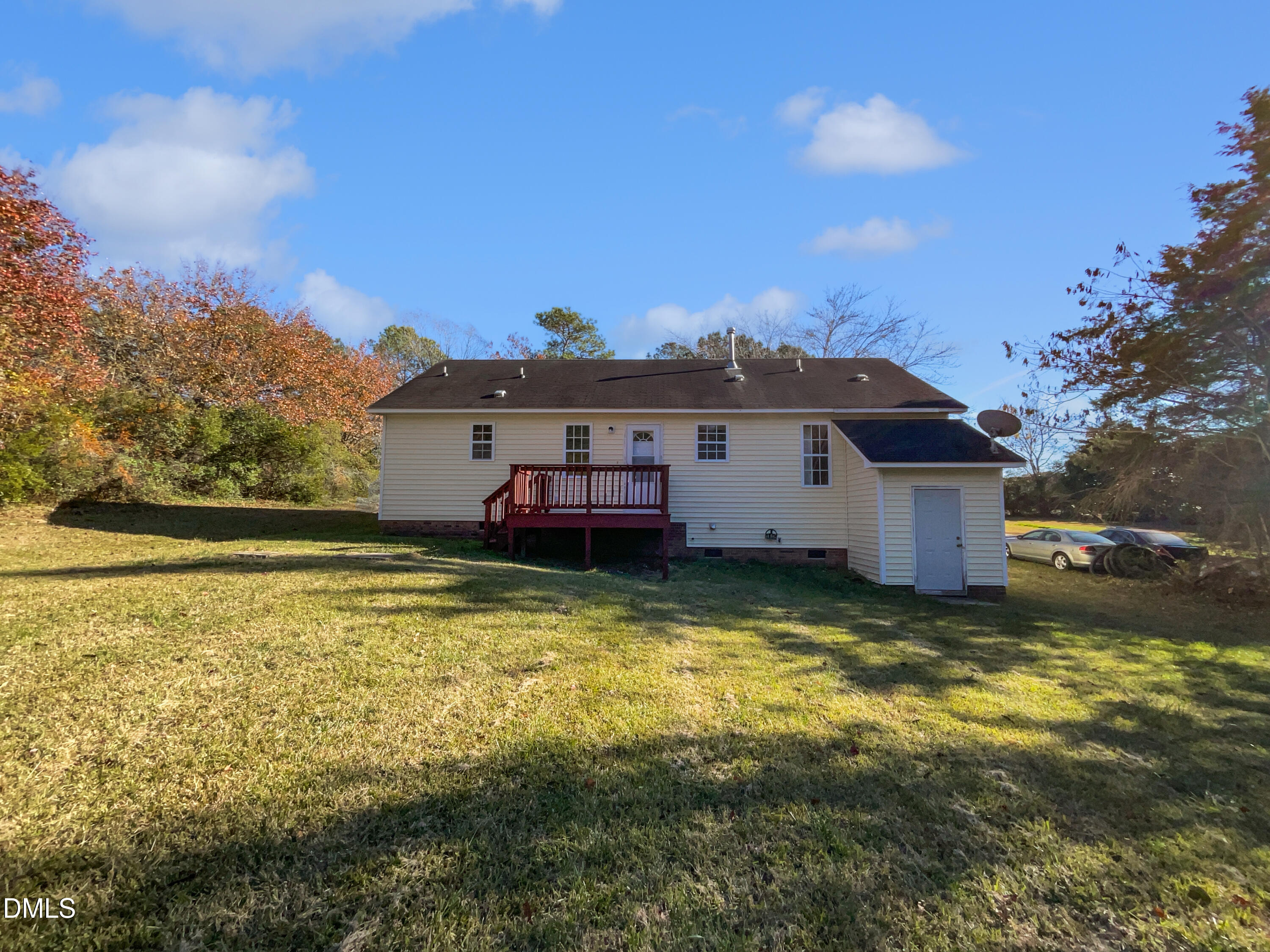 9025 Ferrell Road Zebulon, NC 27597 - Photo 18 of 19 a view of a house with a yard
