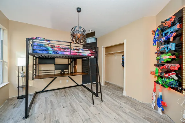 a view of entryway with a flower pot and wooden floor