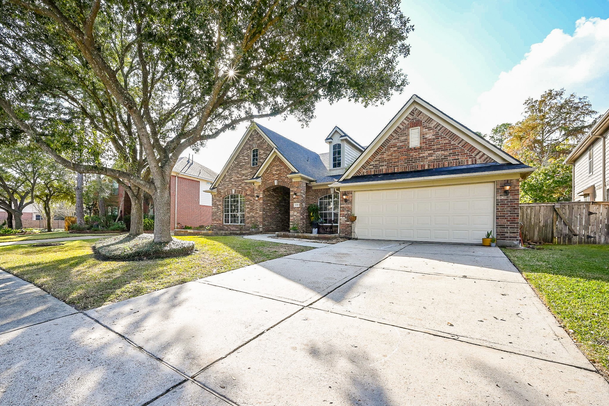 1331 Bishops Pl Drive Spring, TX 77379 - Photo 4 of 31 a front view of a house with garden