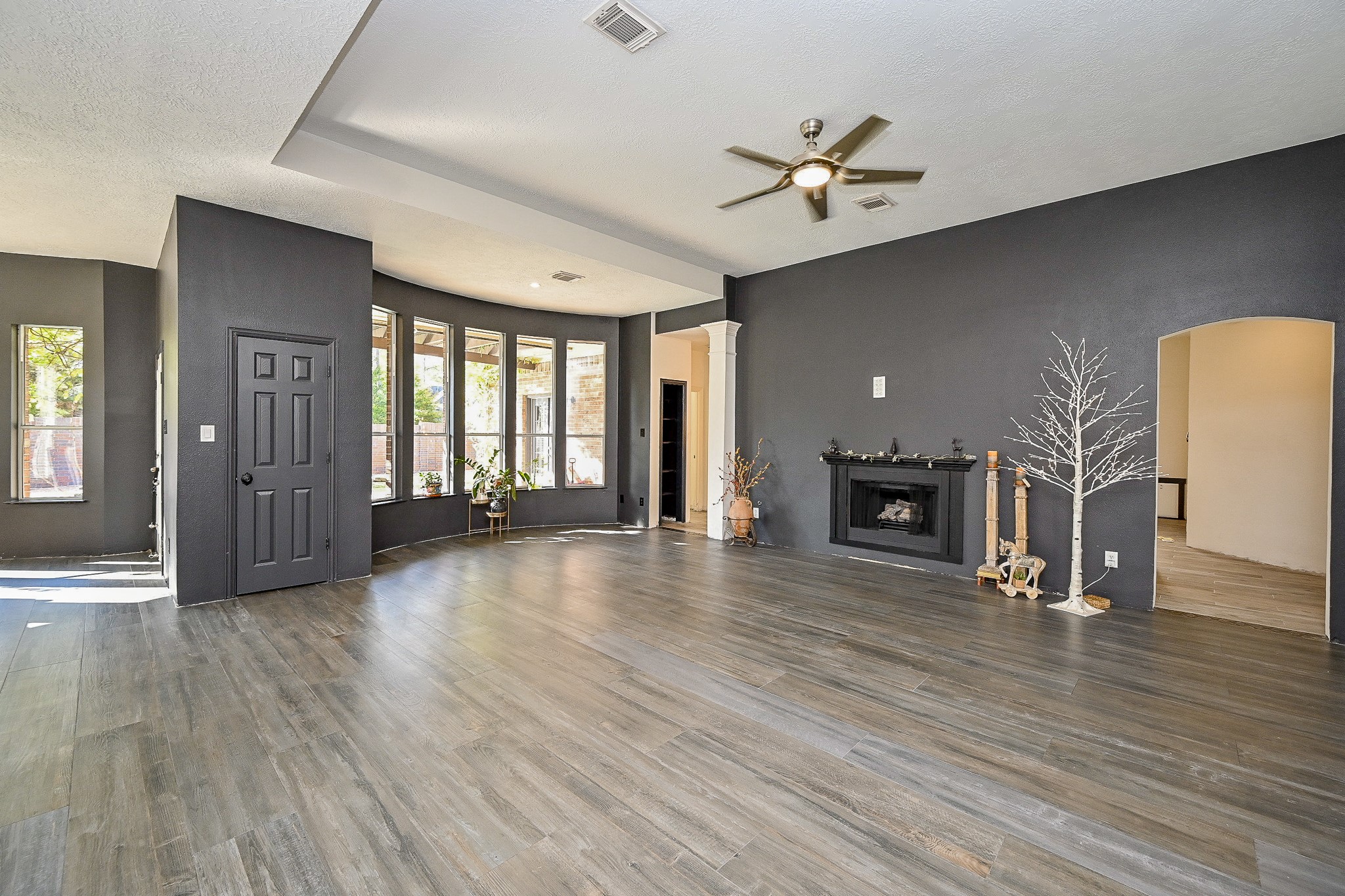 1331 Bishops Pl Drive Spring, TX 77379 - Photo 8 of 31 wooden floor in an empty room with a fireplace