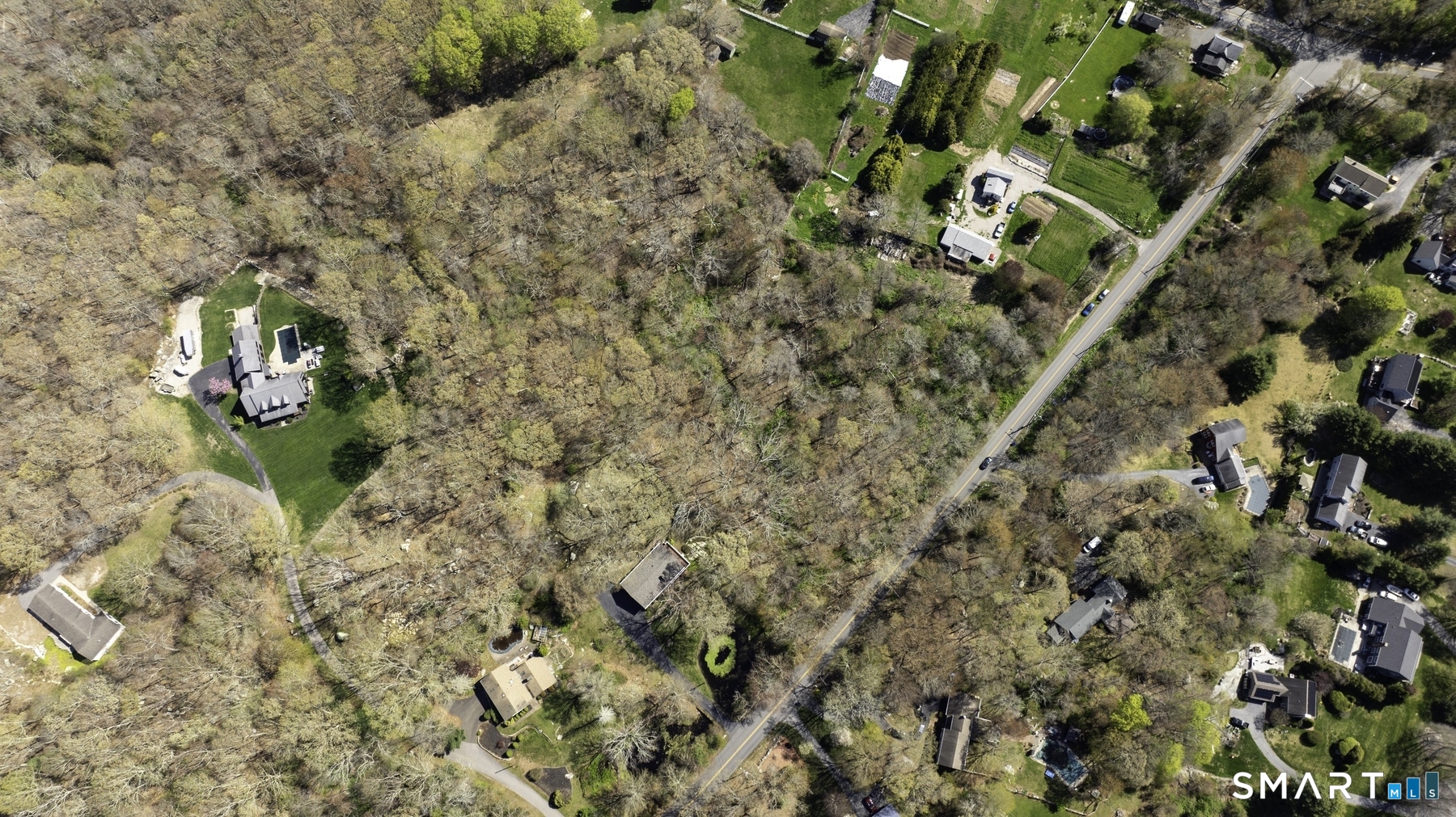 98 Braman Road Waterford, CT 06385 - Photo 7 of 15 a backyard of a house with lots of green space