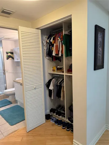a view of a book shelf in a room
