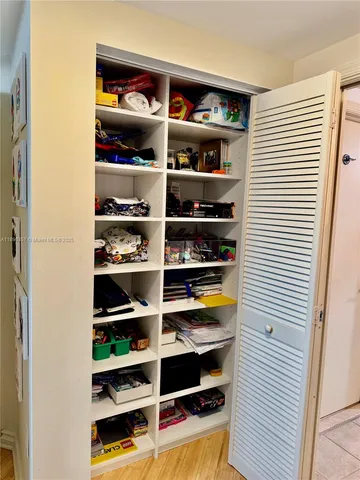 a bathroom with a granite countertop toilet sink and mirror