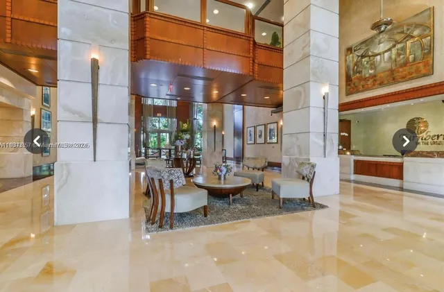 a view of swimming pool with a table and chairs