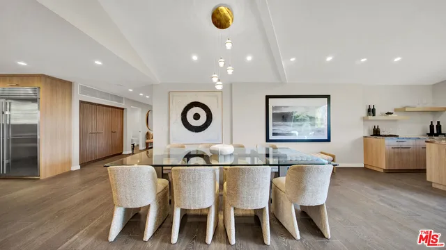 a bed room with a bed and a chandelier