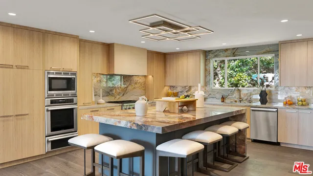 a bathroom with a granite countertop sink mirror toilet and shower