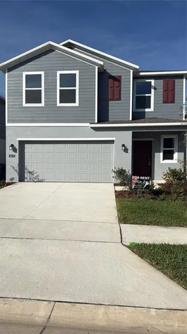 a view of house with yard
