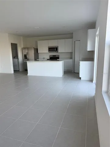 a view of a kitchen with a sink