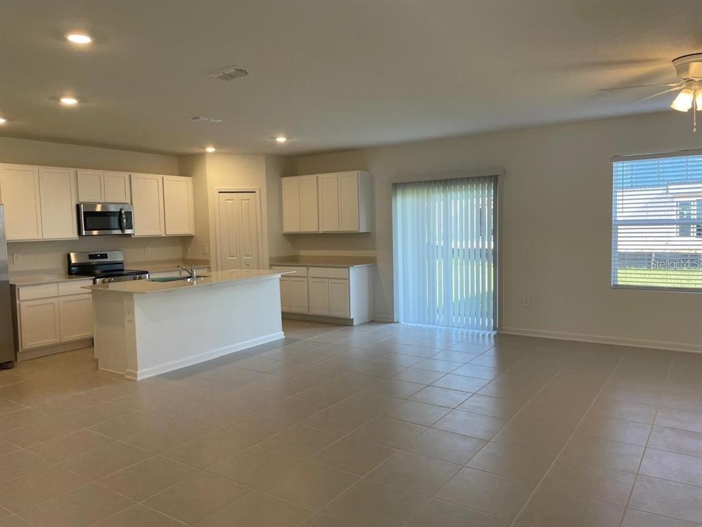 3675 Hardman Dr Lake Lake Wales, FL 33853 - Photo 3 of 11 a large kitchen with cabinets