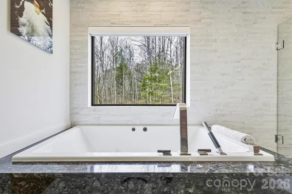 a view of a livingroom with furniture and staircase