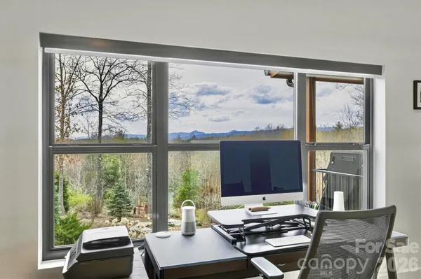 a view of a swimming pool with a table and chairs