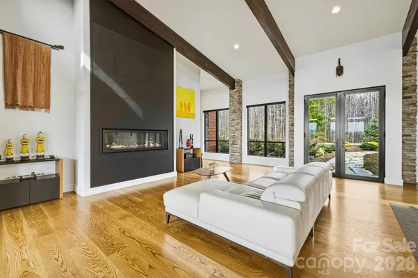 a kitchen with a table chairs sink and cabinets