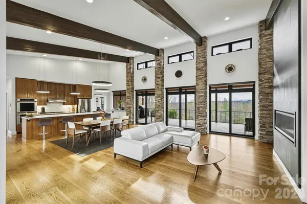 a view of a kitchen with wooden floor