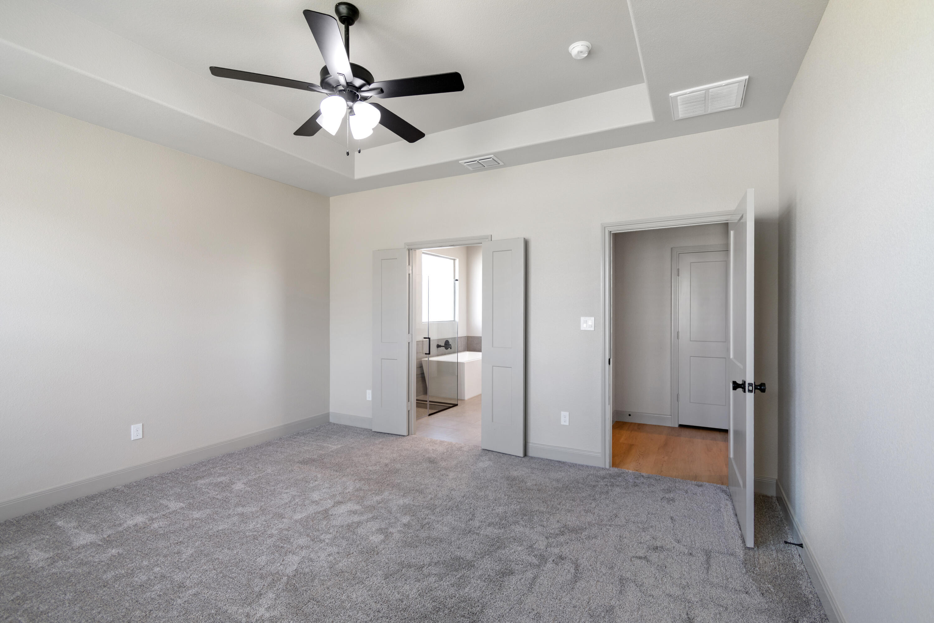 2802 134th Street Lubbock, TX 79423 - Photo 21 of 27 wooden floor in an empty room and a bathroom
