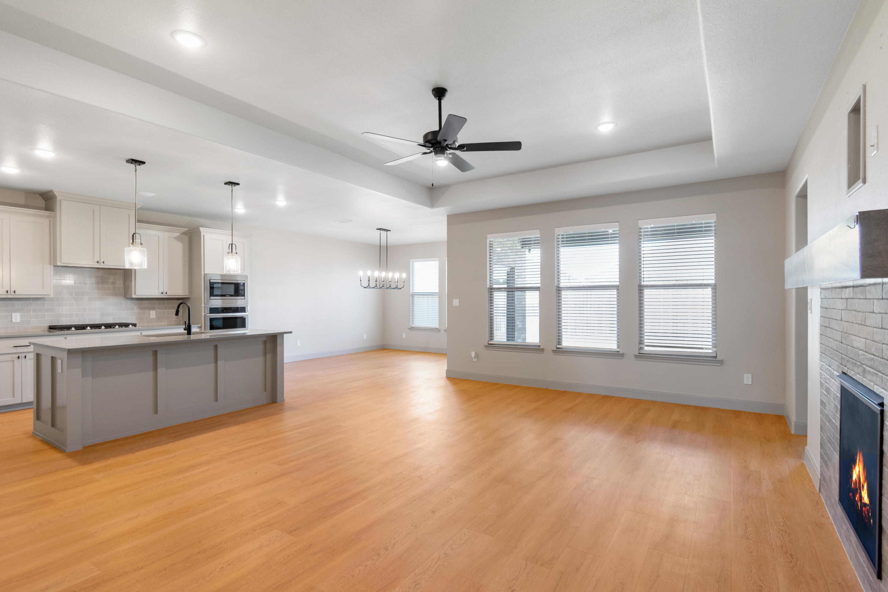 2802 134th Street Lubbock, TX 79423 - Photo 3 of 27 a view of an empty room with a kitchen and a window