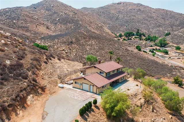 an aerial view of a house with a garden