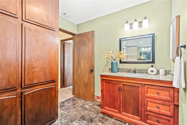 a bathroom with a double vanity sink and mirror