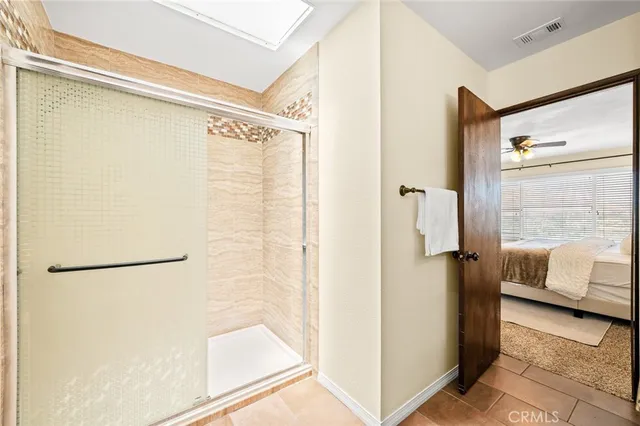 a bathroom with a shower and a sink
