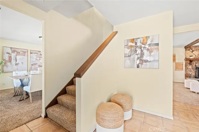 a living room with furniture and white walls