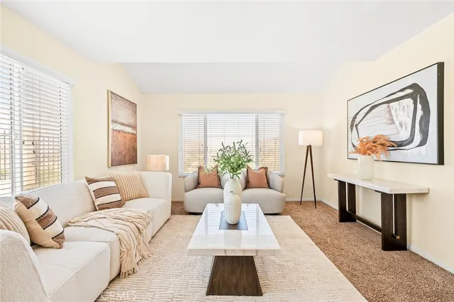 a living room with furniture rug and window
