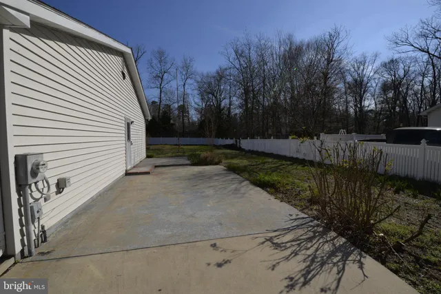 a view of a dry yard with wooden floor and lake view