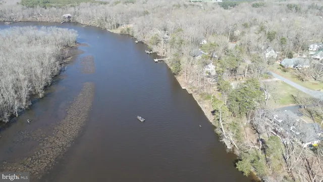 a view of a house with snow on the road
