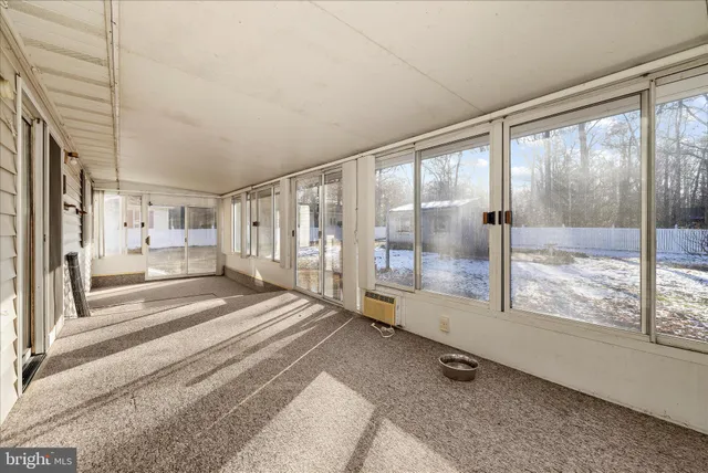 a bathroom with a sink a toilet and a window