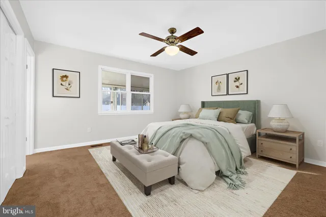 a bedroom with a bed and window