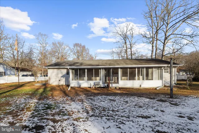 a sign that is sitting on a rock