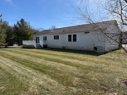 a backyard of a house with large trees