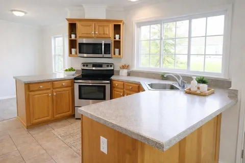 a kitchen with a stove a sink and a microwave