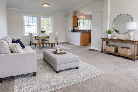 a living room with furniture and window