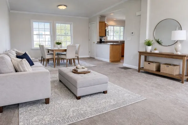 a living room with furniture and window