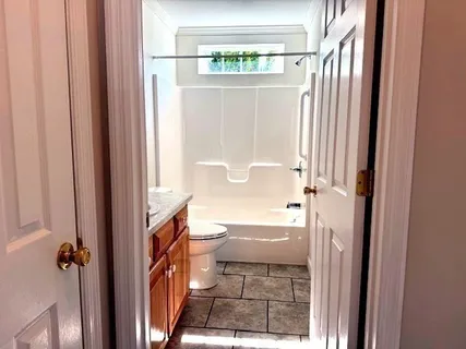 a bathroom with a bathtub and a shower