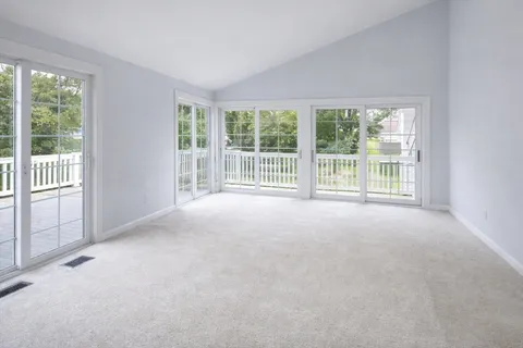 a view of an empty room with a balcony