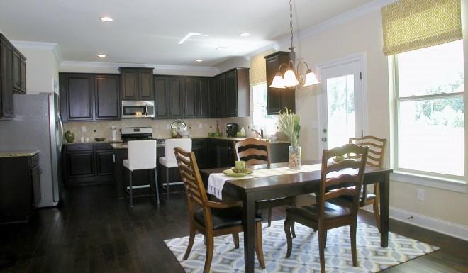 3609 Sycamore Bend Decatur, GA 30034 - Photo 1 of 1 a kitchen with a dining table chairs and refrigerator