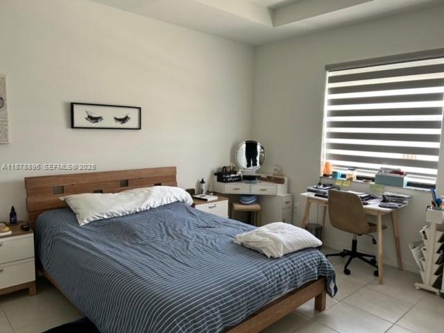 11914 Southwest 241st Street Homestead, FL 33032 - Photo 11 of 25 a bedroom with a bed and a desk