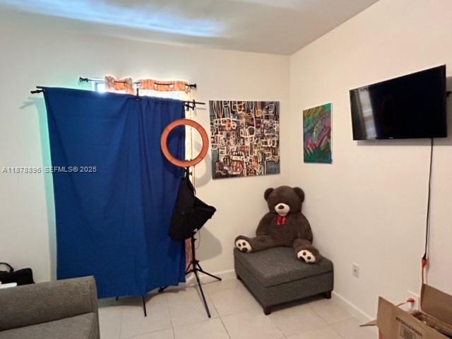 11914 Southwest 241st Street Homestead, FL 33032 - Photo 16 of 25 a living room with furniture and a flat screen tv