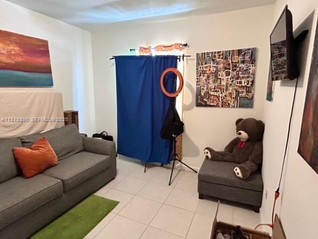 11914 Southwest 241st Street Homestead, FL 33032 - Photo 18 of 25 a living room with furniture and a flat screen tv