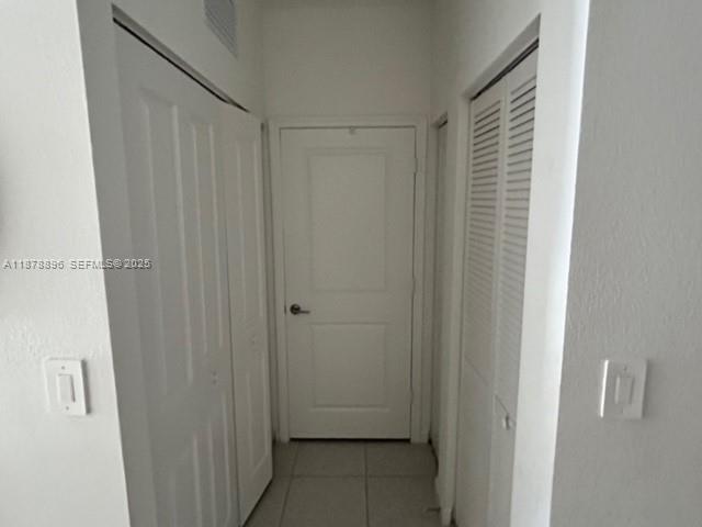 11914 Southwest 241st Street Homestead, FL 33032 - Photo 19 of 25 a view of a closet area