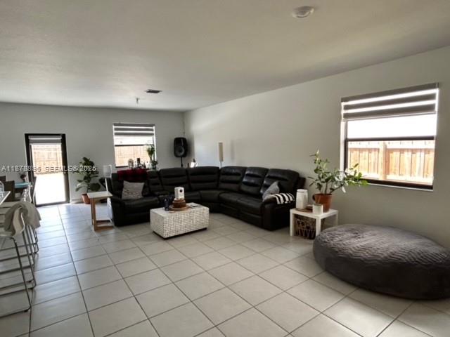 11914 Southwest 241st Street Homestead, FL 33032 - Photo 2 of 25 a living room with furniture and a window