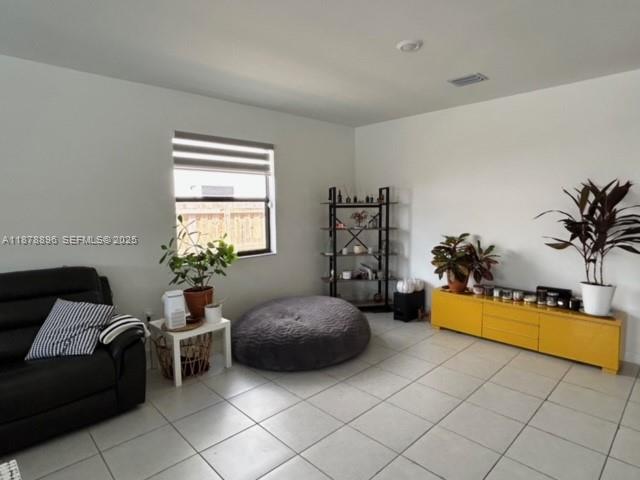 11914 Southwest 241st Street Homestead, FL 33032 - Photo 3 of 25 a bedroom with furniture and a bed