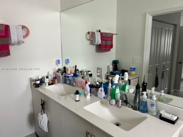11914 Southwest 241st Street Homestead, FL 33032 - Photo 7 of 25 a bathroom with a sink and a mirror