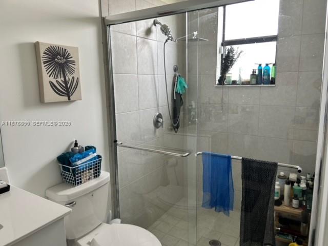 11914 Southwest 241st Street Homestead, FL 33032 - Photo 8 of 25 a bathroom with a toilet sink and shower