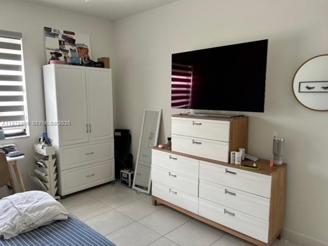 11914 Southwest 241st Street Homestead, FL 33032 - Photo 10 of 25 a living room with closet and flat screen tv